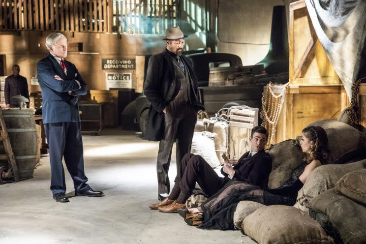 Victor Garber as Martin Stein, Jesse L. Martin as Joe West, Grant Gustin as Barry Allen, and Melissa Benoist as Kara in <em>The Flash</em>. (Credit: Katie Yu/The CW)