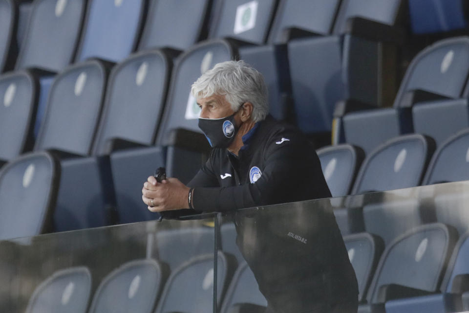 Atalanta's head coach Gian Piero Gasperini follows the game from the stands after getting a red card during the Serie A soccer match between Atalanta and Sassuolo at the Gewiss Stadium in Bergamo, Italy, Sunday, June 21, 2020. Atalanta is playing its first match in Bergamo since easing of lockdown measures, in the area that has been the epicenter of the hardest-hit province of Italy's hardest-hit region, Lombardy, the site of hundreds of COVID-19 deaths. (AP Photo/Luca Bruno)