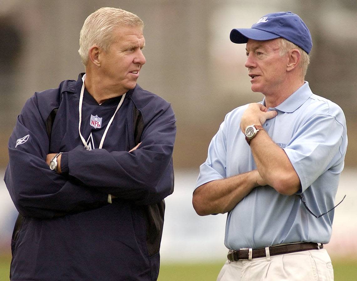 2004: Dallas Cowboys coach Bill Parcells, left, and team owner Jerry Jones, right, chat on the sideline at the start of morning practice at training camp in Oxnard, Calif.