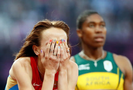 FILE PHOTO: Russia's Mariya Savinova reacts after she won gold ahead of second placed South Africa's Caster Semenya in the women's 800m final at the London 2012 Olympic Games at the Olympic Stadium, Britain, August 11, 2012. REUTERS/Lucy Nicholson/File Photo