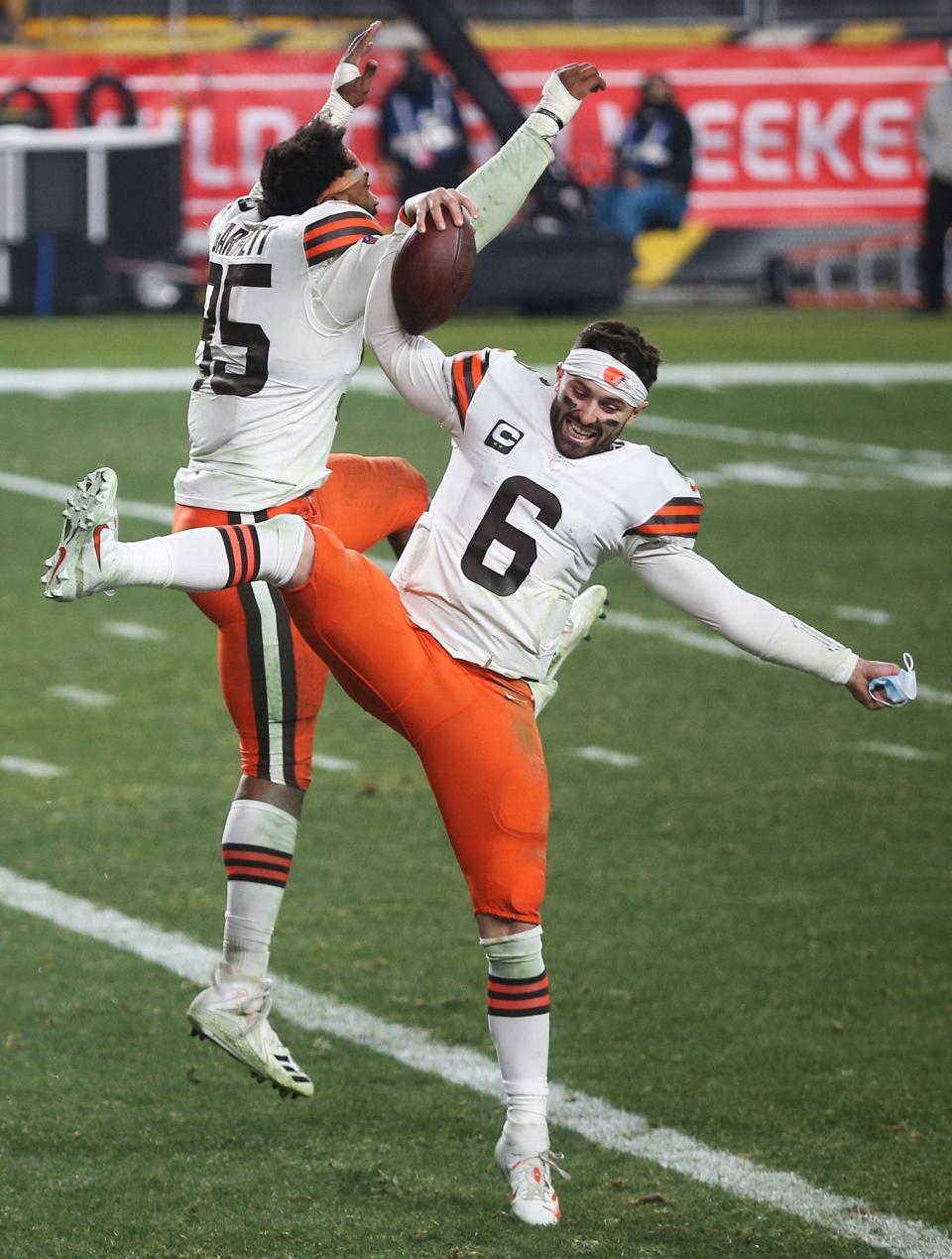 Baker Mayfield (6) celebrates with Myles Garrett after defeating the Pittsburgh Steelers in an AFC wild-card playoff game on Jan. 10, 2021.