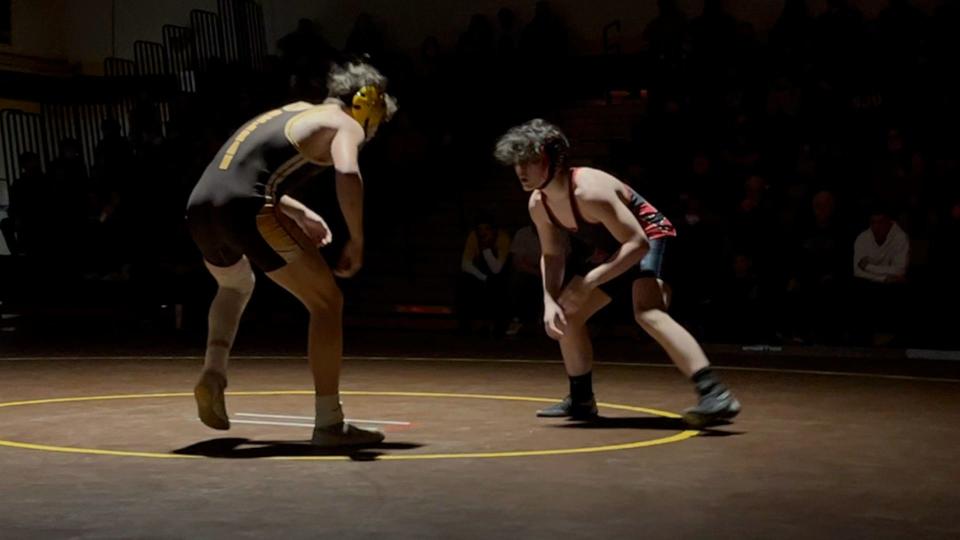 Cinnaminson freshman 157-pounder Eddie Frey (right) looks for an opening as he circles Dominik Milam of Delran in their bout on Tuesday, January 25, 2022.
