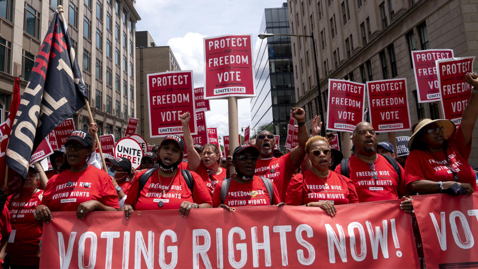 Demonstrators march during a Freedom Ride for Voting Rights rally in Washington, D.C., U.S., on Saturday, June 26, 2021. (Stefani Reynolds/Bloomberg via Getty Images)