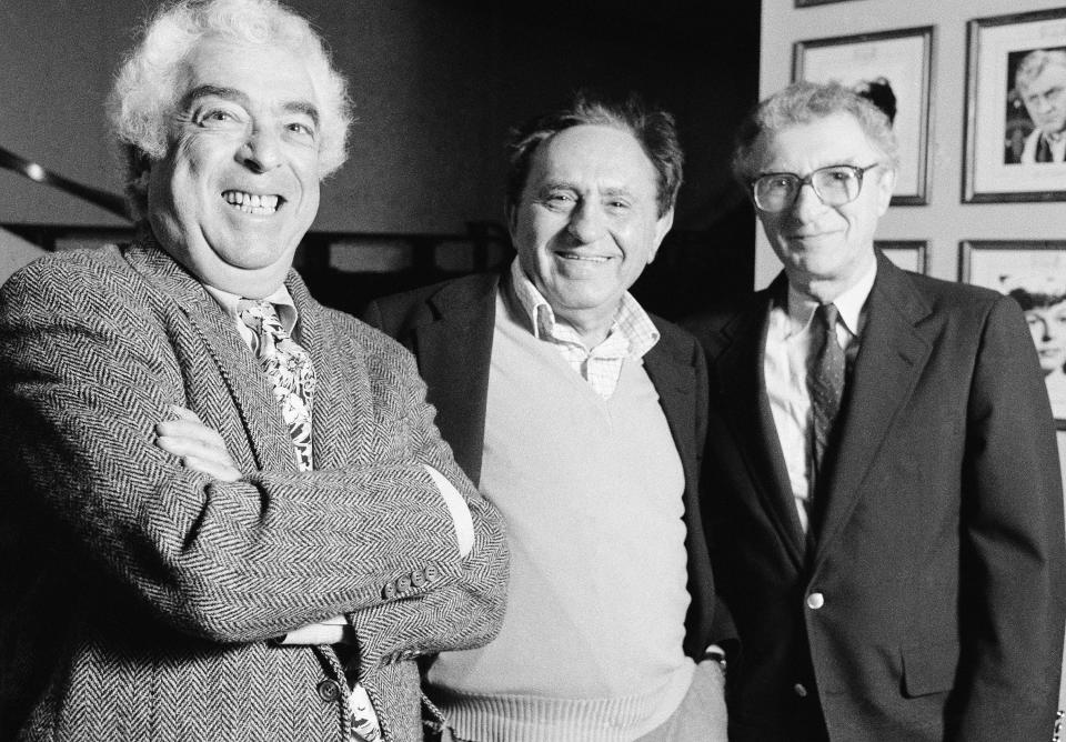FILE - The creators of “Fiddler on the Roof," composer Jerry Bock, from left, writer Joseph Stein, and lyricist Sheldon Harnick, appear at the George Gershwin Theater in New York on Nov. 5, 1990. Harnick, who with composer Bock made up the premier musical-theater songwriting duos of the 1950s and 1960s with shows such as "Fiddler on the Roof," "Fiorello!" and "The Apple Tree," died Friday. He was 99. (AP Photo/Marty Reichenthal, File)