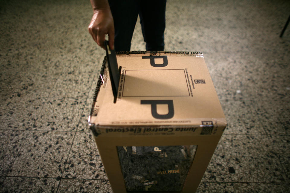 A voter casts his ballot during the presidential election in Santo Domingo, Dominican Republic, Sunday, May 20, 2012. (AP Photo/Ricardo Arduengo)
