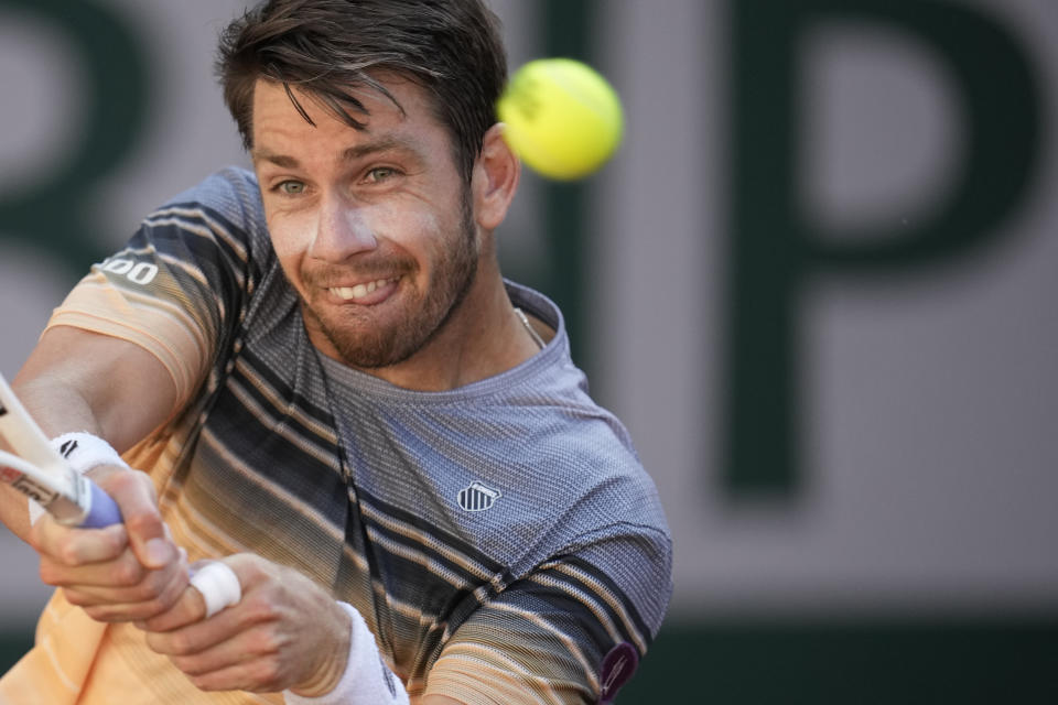 Britain's Cameron Norrie plays a shot against France's Lucas Pouille during their second round match of the French Open tennis tournament at the Roland Garros stadium in Paris, Wednesday, May 31, 2023. (AP Photo/Christophe Ena)