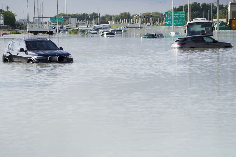 Abandoned vehicles in floodwater