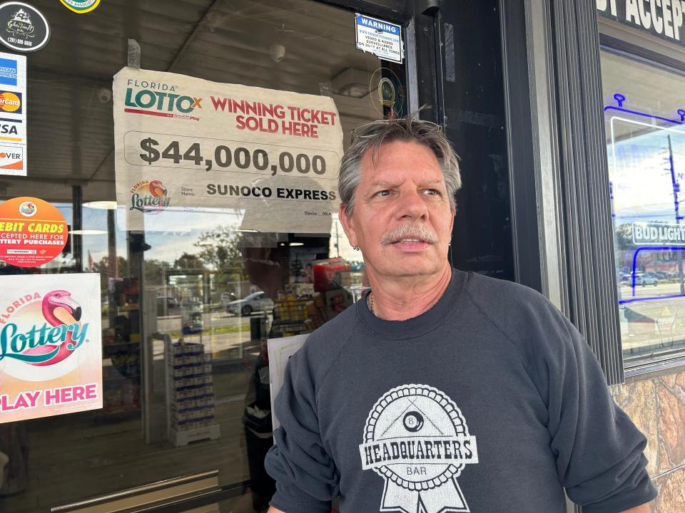 Jeff Base, 62, stands outside a gas station in Kissimmee, Fla., where a lottery ticket worth $44 million was sold in June and remained unclaimed.