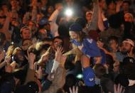 University of Kentucky fans and students take to the streets after the University of Connecticut defeated Kentucky in the NCAA Men's National Basketball Championship near the university campus in Lexington, Kentucky, April 7, 2014. REUTERS/ John Sommers II (UNITED STATES - Tags: SPORT BASKETBALL CIVIL UNREST)