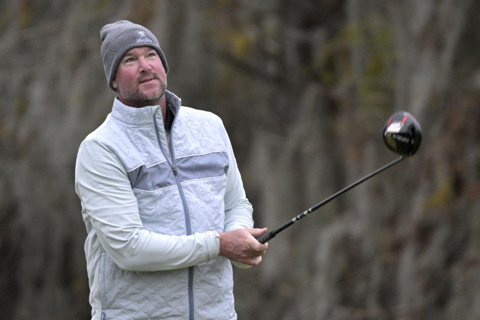 Former professional baseball player Derek Lowe watches his tee shot on the 18th hole during the third round of the Tournament of Champions LPGA golf tournament, Saturday, Jan. 22, 2022, in Orlando, Fla. (AP Photo/Phelan M. Ebenhack)