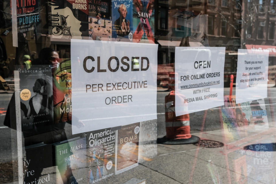 A sign explaining that a bookstore will remain closed, due to the outbreak of the coronavirus disease (COVID-19) in the Brooklyn borough of New York City, U.S., March 26, 2020. REUTERS/Stephen Yang