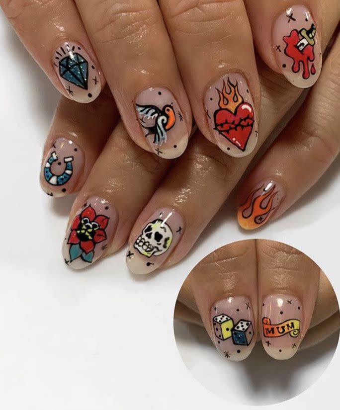 <p>Think outside the traditional Halloween, err, coffin, with this old school <a href="https://www.instagram.com/p/B4f5W_VASiw/" rel="nofollow noopener" target="_blank" data-ylk="slk:tattoo-themed nail art by Emily Isabella;elm:context_link;itc:0;sec:content-canvas" class="link ">tattoo-themed nail art by Emily Isabella</a> that could work with a variety of costumes—or just on their own!</p><p><a class="link " href="https://go.redirectingat.com?id=74968X1596630&url=https%3A%2F%2Fwww.urbanoutfitters.com%2Fshop%2Ftattoo-art-nails-kit&sref=https%3A%2F%2Fwww.oprahdaily.com%2Fbeauty%2Fskin-makeup%2Fg33239588%2Fhalloween-nail-ideas%2F" rel="nofollow noopener" target="_blank" data-ylk="slk:SHOP NAIL KIT;elm:context_link;itc:0;sec:content-canvas">SHOP NAIL KIT</a></p>