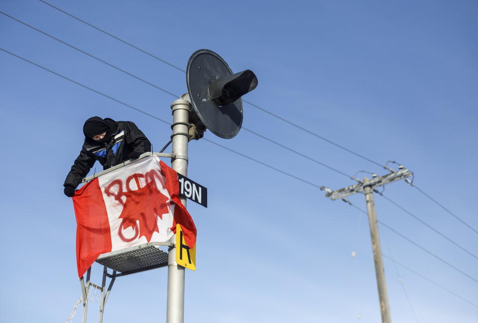 Supporters of the Wet'suwet'en who are against the LNG pipeline, block a Canadian National Railway line just west of Edmonton, Ontario, on Wednesday, Feb. 19, 2020. (Jason Franson/The Canadian Press via AP)