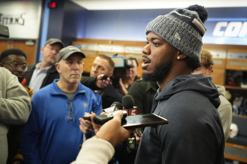 Tennessee Titans linebacker Azeez Al-Shaair, right, responds to questions from reporters at the NFL football team's training facility, Monday, Jan. 8, 2024, in Nashville, Tenn. (AP Photo/George Walker IV)