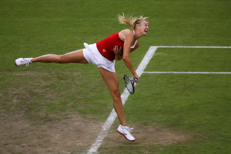 LONDON, ENGLAND - JULY 29: Maria Sharapova of Russia serves during the Women's Singles Tennis match against Shahar Peer of Israel on Day 2 of the London 2012 Olympic Games at the All England Lawn Tennis and Croquet Club in Wimbledon on July 29, 2012 in London, England. (Photo by Clive Brunskill/Getty Images)