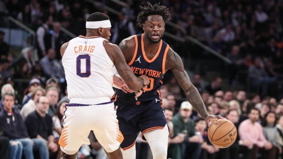 Jan 2, 2023; New York, New York, USA; New York Knicks forward Julius Randle (30) looks to drive past Phoenix Suns forward Torrey Craig (0) in the first quarter at Madison Square Garden.