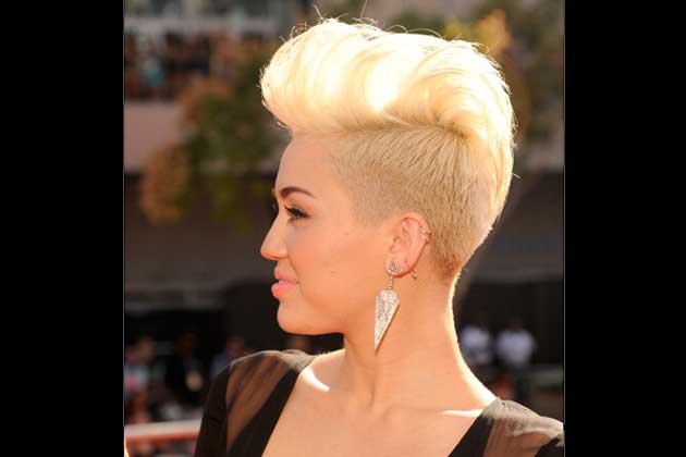 <b>September 2012</b> <br>Miley turns heads with a bleach-blonde Mohawk at the recent MTV Music Awards.