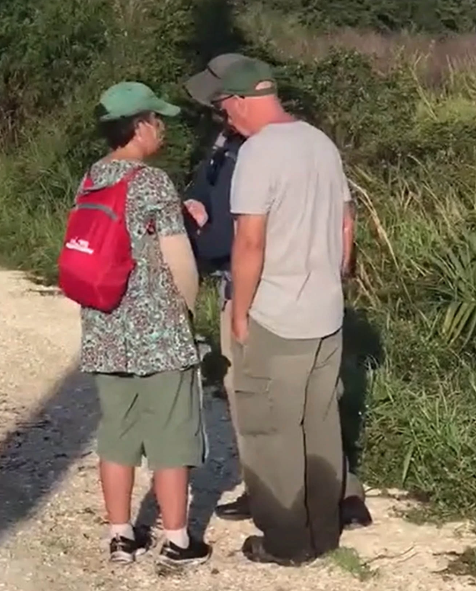 Roberta and Chris Laundrie speak to a law enforcement officer on Wednesday (Fox News)