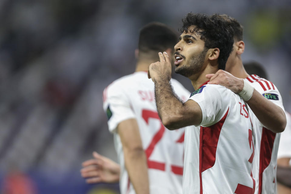 United Arab Emirates' Zayed Sultan Alzaabi gestures towards the crowd as he celebrates scoring a goal during the Asian Cup Group C soccer match between Hong Kong and United Arab Emirates at Khalifa International Stadium in Doha, Qatar, Sunday, Jan. 14, 2024. (AP Photo/Hussein Sayed)