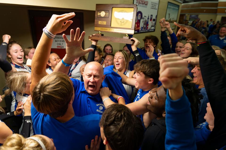 Washburn Rural players and students celebrate with head coach Kevin Bordewick after winning the state championship on Saturday at Tony’s Pizza Events Center in Salina.