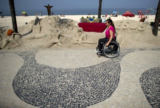 Brazilian Viviane Macedo, 35, rides her wheelchair at Copacabana beach in Rio de Janeiro. Only half of the city's bus fleet is adapted to carry the handicapped, compared with 100 percent in London, which has just staged very successful Paralympics