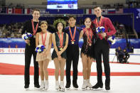 CORRECTS NAMES OF RUSSIAN PAIR - Silver medalists Kirsten Moore-Towers and Michael Marinaro of Canada, left, gold medalists Sui Wenjing and Han Cong of China, center, and bronze medalists Anastasia Mishina and Aleksandr Galliamov of Russia pose with their medals at a victory ceremony after the pairs free skating program during the ISU Grand Prix of Figure Skating in Sapporo, northern Japan, Saturday, Nov. 23, 2019. (AP Photo/Toru Hanai)