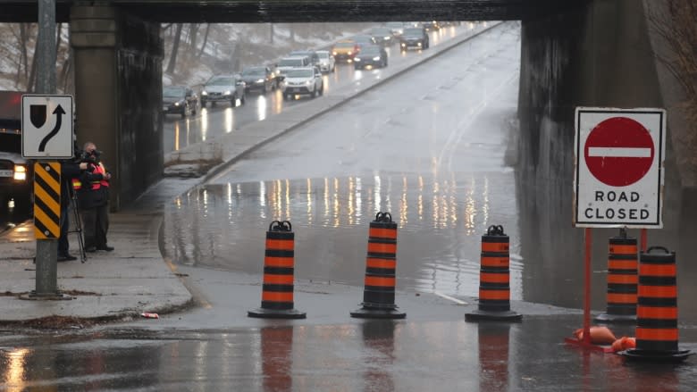 Heavy rain, mild weather causing trouble on Toronto roads, waterways