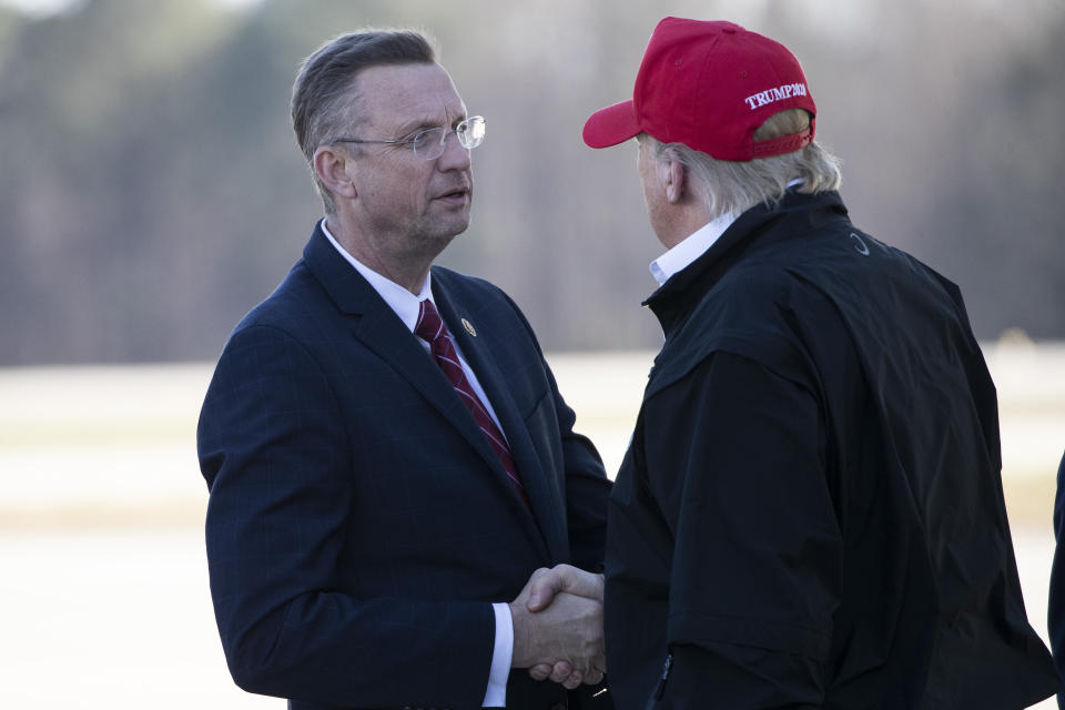 Rep. Doug Collins (R-Ga.) greets President Donald Trump last Friday as Air Force One arrived in Atlanta. Collins later learned that in late February he had come into contact with someone who tested positive for coronavirus. (Photo: ASSOCIATED PRESS)