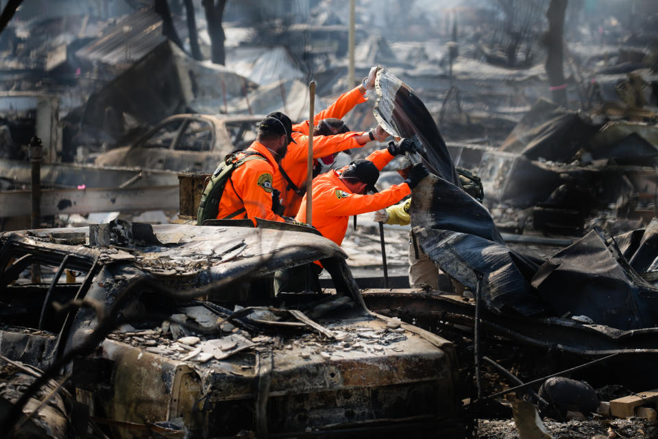 <p>Search and Rescue personnel look for human remains in the Journey’s End Mobile Home park following the damage caused by the Tubbs Fire on Oct.13, 2017 in Santa Rosa, Calif. (Photo: Elijah Nouvelage/Getty Images) </p>