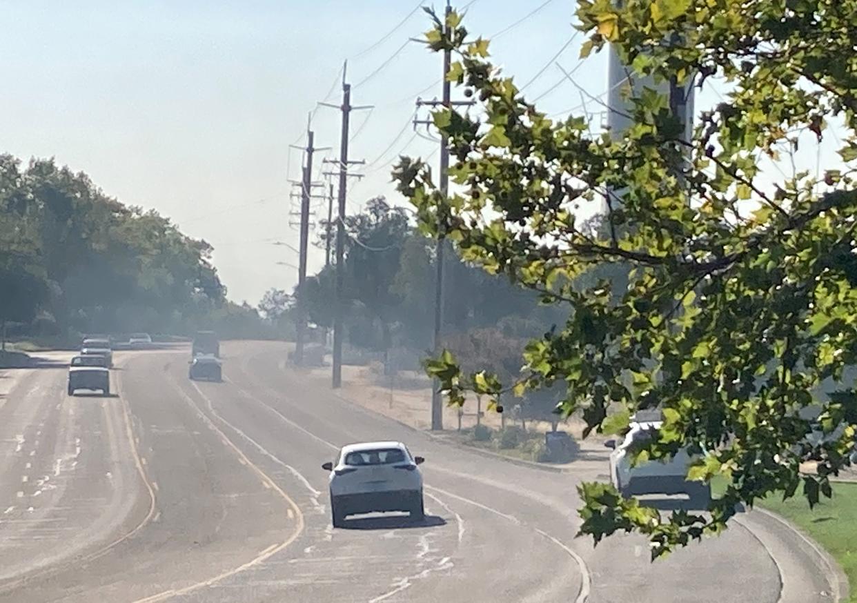 Wind pushed smoke from wildfires burning in the North State over Hilltop Drive in Redding on Monday Aug. 15, 2022.