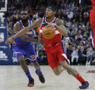 Washington Wizards guard Bradley Beal (3), right, drives to the basket as New York Knicks guard Tim Hardaway Jr. (3)defends, during an NBA basketball game between New York Knicks and Washington Wizards at the O2 Arena, in London, Thursday, Jan.17, 2019. (AP Photo/Alastair Grant)