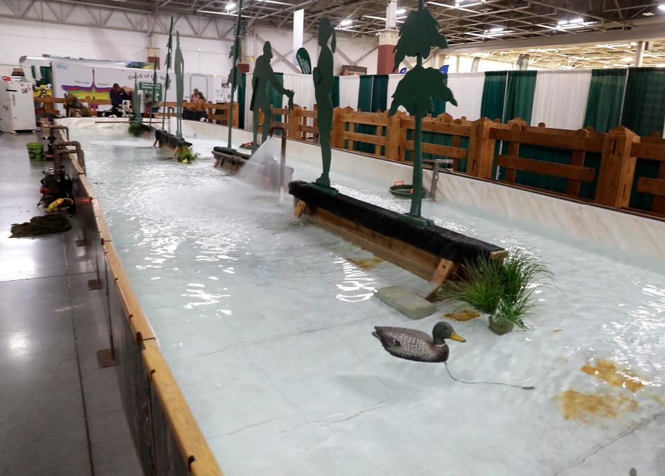 The trout pond at the Milwaukee Journal Sentinel Sports Show is so large that designer Jim Hill leaves it in Wisconsin and comes back each spring to set it up.