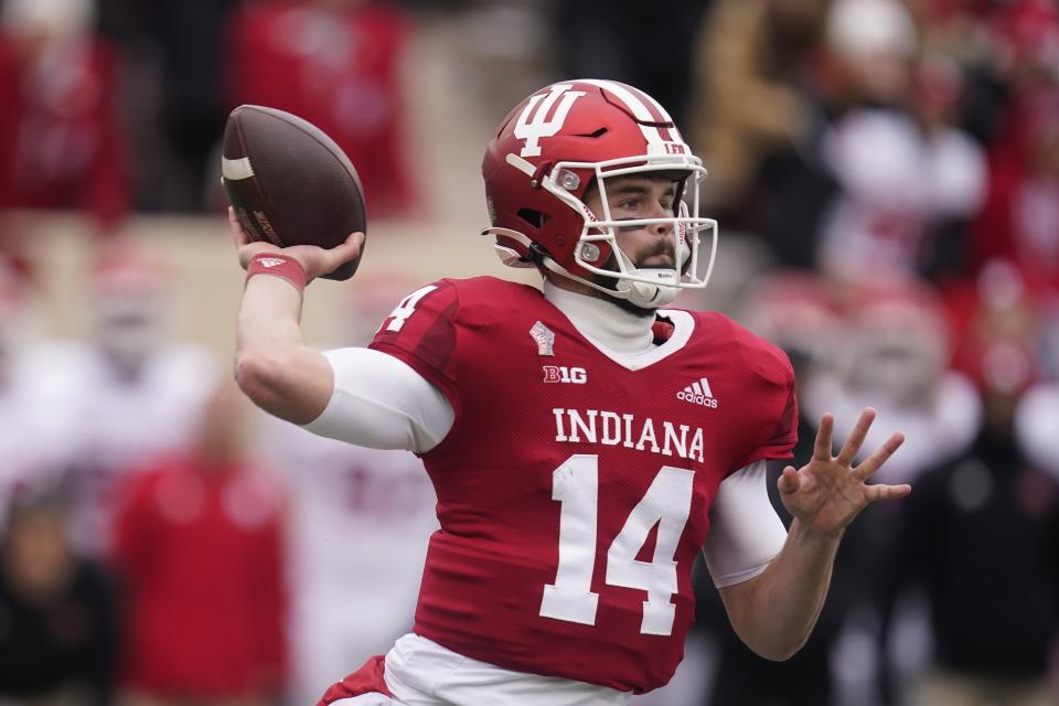 FILE - Indiana quarterback Jack Tuttle (14) throws during the first half of an NCAA college football game against Rutgers, Saturday, Nov. 13, 2021, in Bloomington, Ind. Indiana backup quarterback Jack Tuttle announced Monday, Oct. 17, 2022, that he will transfer at the end of this season. Coach Tom Allen confirmed the news at the start of his weekly news conference, explaining the two spoke last week and that Tuttle, a team captain, would remain No. 2 on the depth chart. (AP Photo/Darron Cummings, File)