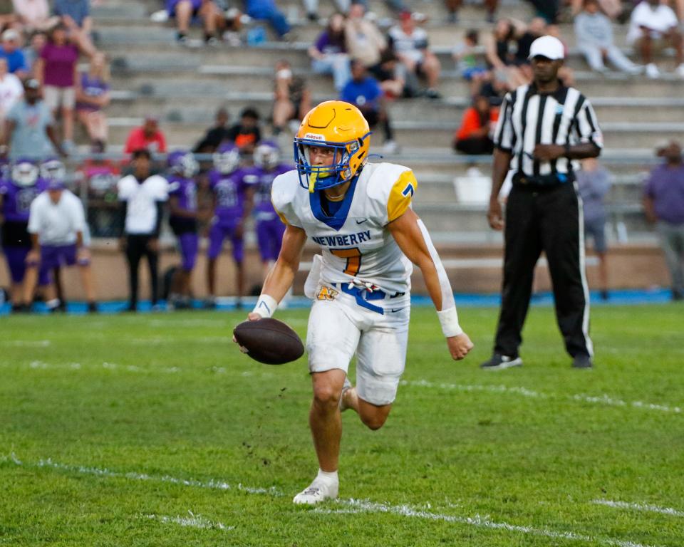 Newberry High School's quarterback Keil McGriff (7) plays against the Hurricanes as they host Newberry High School for the spring football game at Citizens' Field in Gainesville, FL on Friday, May 19, 2023. [Gabriella Whisler/Special to the Sun/Special to the Sun}