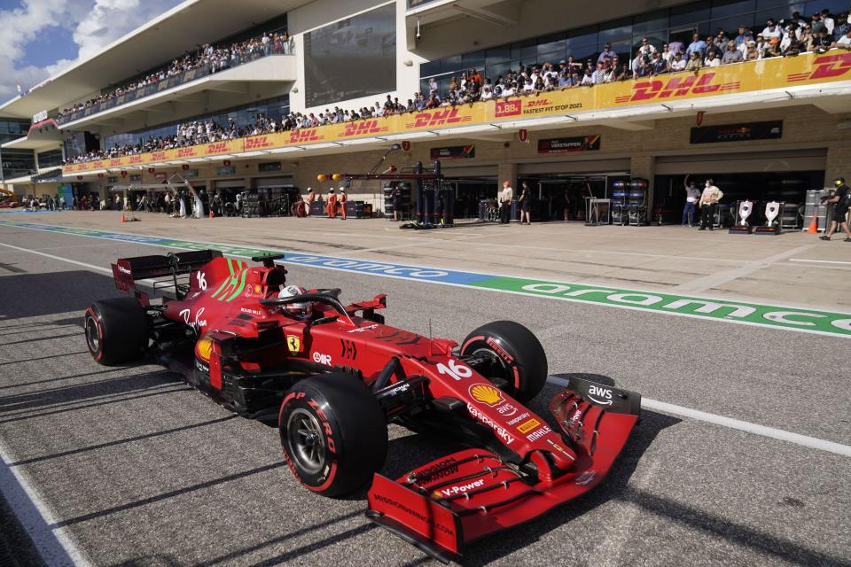 Ferrari's Monegasque driver Charles Leclerc leaves the pits during the qualifying session at the Circuit of The Americas in Austin, Texas