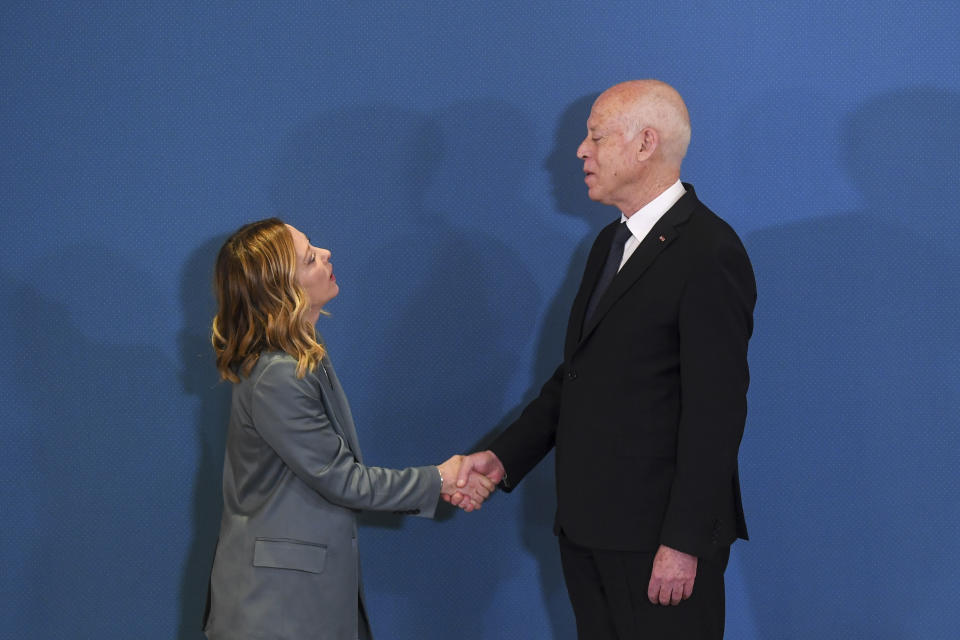 In this photo provided by the Tunisian Presidency, Tunisian President Kais Saied, right, shakes hands with Italian Prime Minister Giorgia Meloni, in Tunis, Wednesday April 17, 2024. Meloni and Saied signed new accords part of Italy's larger "Mattei Plan" for Africa, a continent-wide strategy aimed at growing economic opportunities and preventing migration from Africa to Europe.(Slim Abid/ Tunisian Presidential Palace via AP)