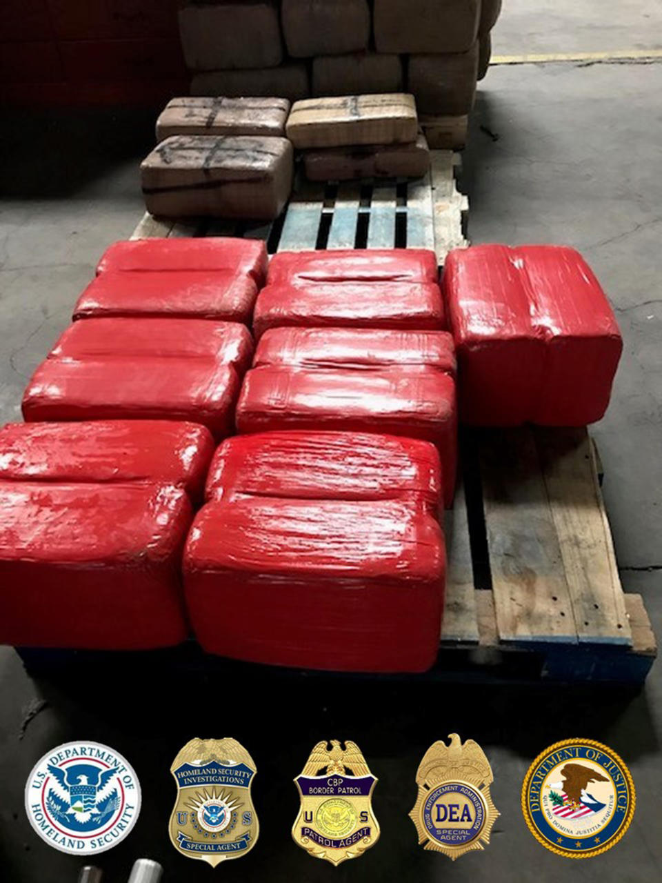 In this photo released Tuesday, March 31, 2020, by the San Diego Tunnel Task Force, Department of Homeland Security, a large haul of drugs that were seized in a cross-border tunnel running from warehouses in Tijuana, Mexico to San Diego are displayed in San Diego. (San Diego Tunnel Task Force/Department of Homeland Security via AP)