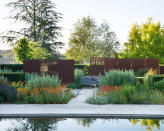 <p> The use of screens to loosely partition and create ‘open’ rooms, artfully divided, is a design trick employed by garden designer by Anthea Harrison in this beautiful country garden. </p> <p> Decorative laser-cut and solid Corten steel screens gently restrain the garden’s more formal elements, while funnelling the view towards specific focal points or garden vistas, and also act as features in themselves. </p>