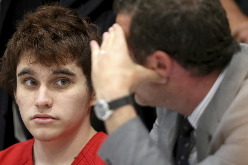 School shooting suspect Nikolas Cruz listens at his defense attorney Gabe Ermine during a hearing at the Broward Courthouse in Fort Lauderdale on Tuesday, May 28, 2019. Cruz, who faces the death penalty if convicted, is accused of killing 17 and wounding 17 in the February 2018 mass shooting at Marjory Stoneman Douglas High School in Parkland, Fla. (Amy Beth Bennett/South Florida Sun Sentinel via AP, Pool)