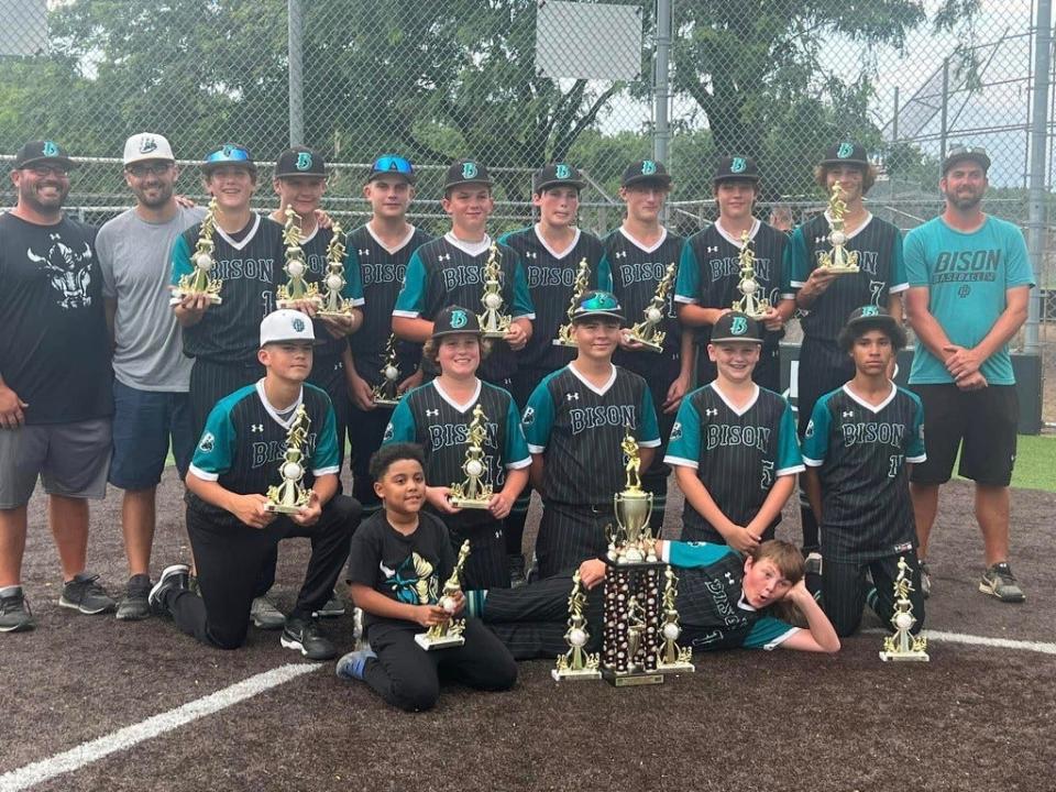 The Ohio Bison 13u team poses with its championship hardware on Sunday at Columbus Berliner Park, after winning the 26-team Columbus Classic. It was their fifth tournament title of the season.