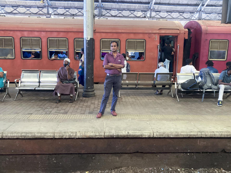 Commuters wait on a platform at the Fort railway station during a trade union strike by locomotive drivers in Colombo, Sri Lanka, Wednesday, Sept. 13, 2023. (AP Photo/Eranga Jayawardena)