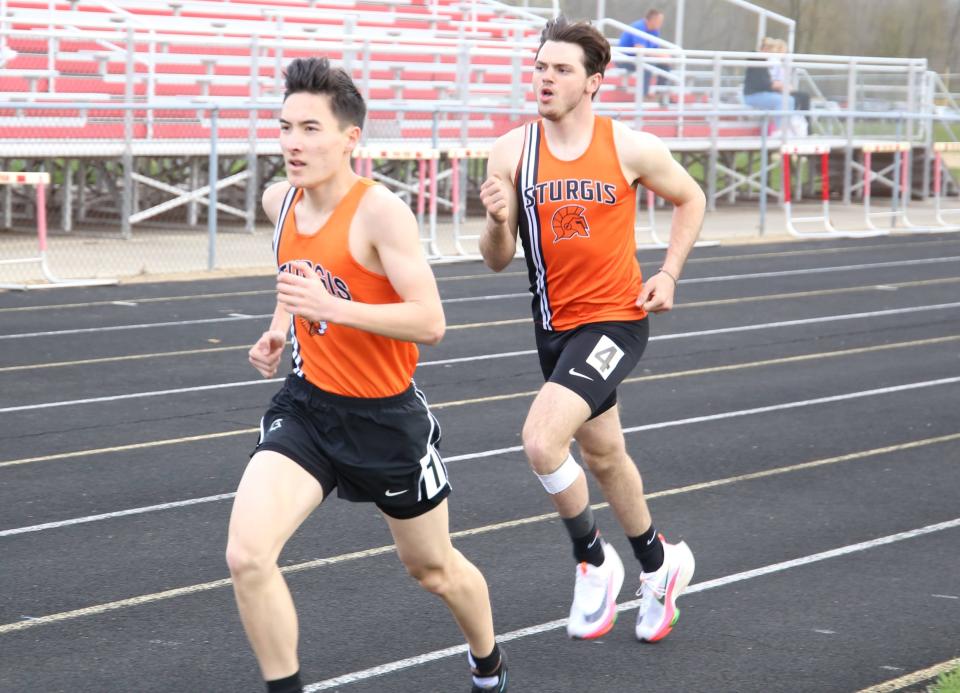 Nolan Park and Brock Fergison run in the mile event on Tuesday for Sturgis.