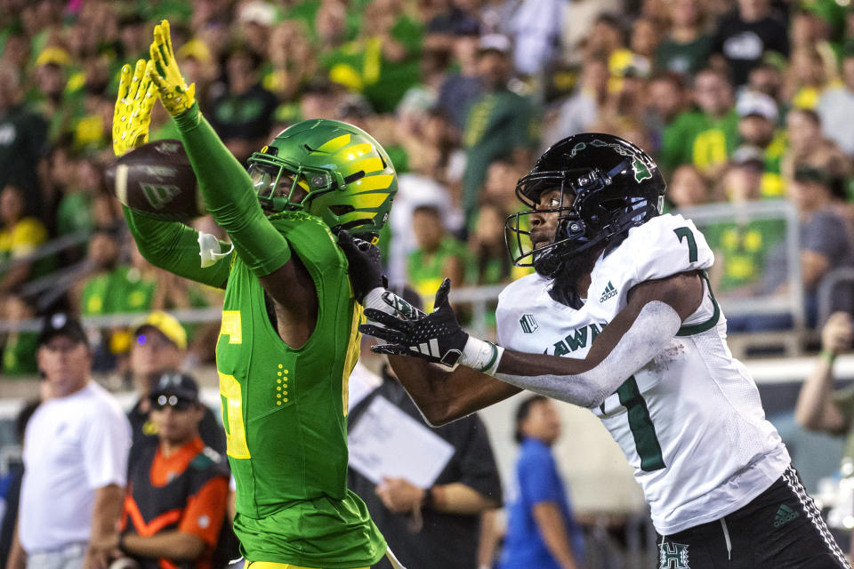 Oregon defensive back Jahlil Florence (6) breaks up a pass in the end zone intended for Hawaii wide receiver Steven McBride (7) during the second half of an NCAA college football game Saturday, Sept. 16, 2023, in Eugene, Ore. (AP Photo/Andy Nelson)