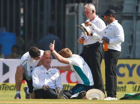 Cricket - India v England - Fourth Test cricket match - Wankhede Stadium, Mumbai, India - 8/12/16. Umpire Paul Reiffel is helped by support staff. REUTERS/Danish Siddiqui