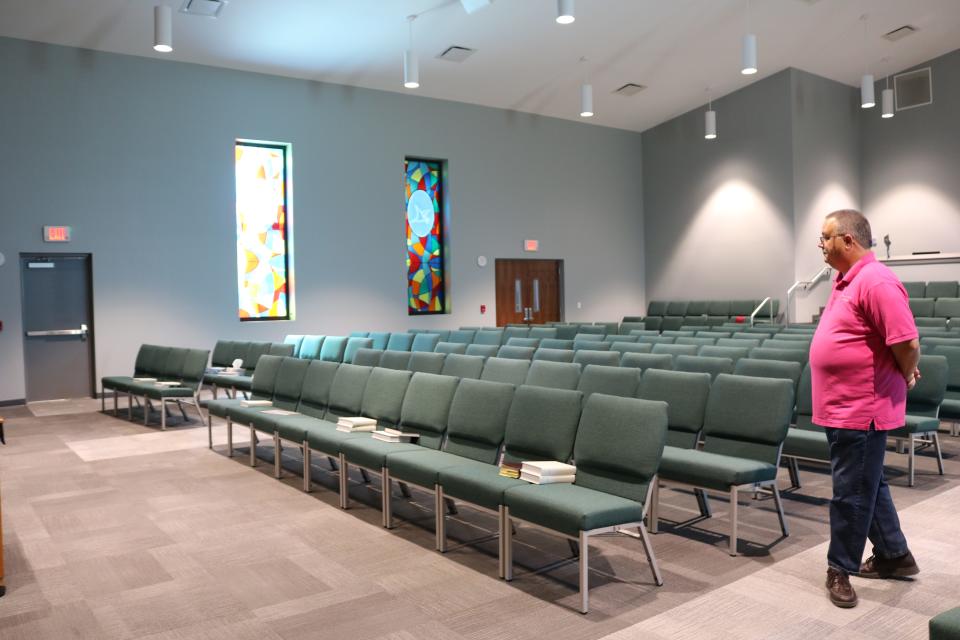 The Rev. Jesse Dasher looks over the rebuilt sanctuary of First Baptist Church of Callaway. The church sustained significant damage from Hurricane Michael.