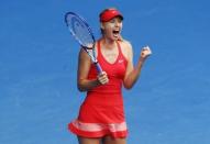 Maria Sharapova of Russia celebrates after defeating Eugenie Bouchard of Canada in their women's singles quarter-final match at the Australian Open 2015 tennis tournament in Melbourne January 27, 2015. REUTERS/Brandon Malone