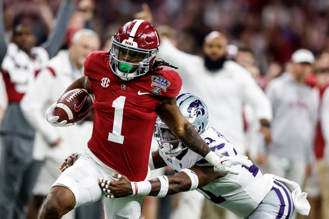 Alabama running back Jahmyr Gibbs (1) is tackled by Kansas State safety Drake Cheatum (21) as he carries the ball during the first half of the Sugar Bowl NCAA college football game Saturday, Dec. 31, 2022, in New Orleans. (AP Photo/Butch Dill)
