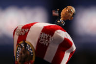 A person wears a hat with a bobblehead of Democratic presidential candidate, U.S. President Barack Obama during day one of the Democratic National Convention at Time Warner Cable Arena on September 4, 2012 in Charlotte, North Carolina. (Photo by Justin Sullivan/Getty Images)