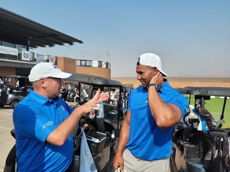 Mark Kubicki, left, and former BYU football star Bryan Kehl talk during Ryder Cup-style event at Sand Hallow Resort in Hurricane, Utah. | Dick Harmon