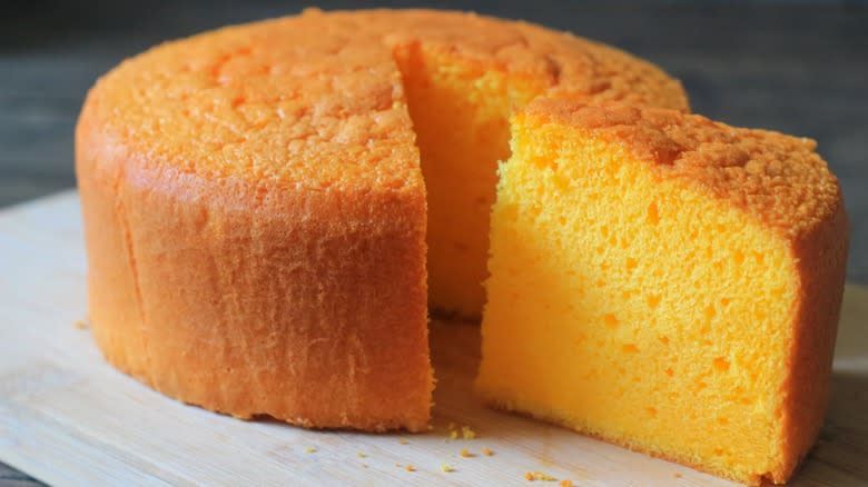 Orange cake with slice removed